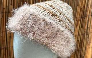 Close up of the fuzzy trim on this handmade knitwear beanie, soft as a cloud and just as dreamy.