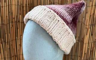 A perky little ear peeking up on this cat ear beanie, handmade knitwear with just the right amount of whimsy.