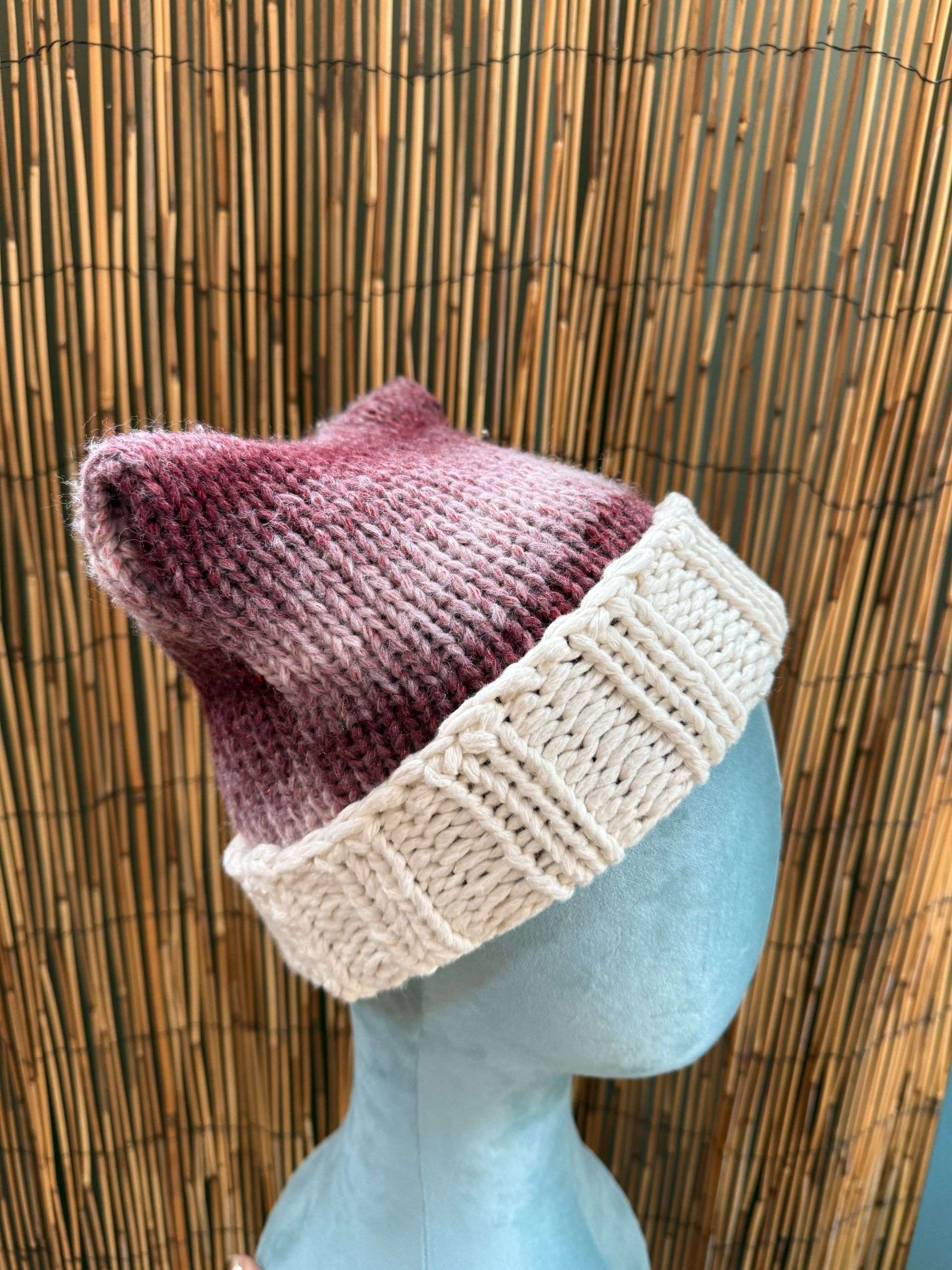 A perky little ear peeking up on this cat ear beanie, handmade knitwear with just the right amount of whimsy.