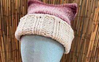 A perky little ear peeking up on this cat ear beanie, handmade knitwear with just the right amount of whimsy.