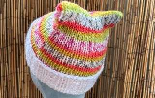 Front view of our striped cat ear beanie, handmade knitwear with ears made for double takes.